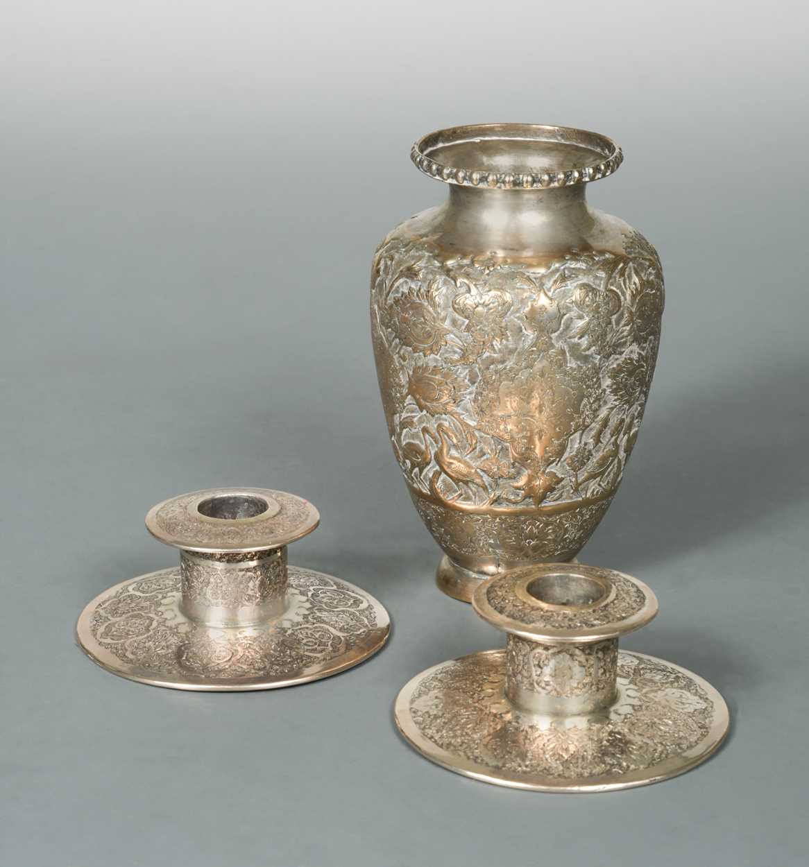 Lot 356 - A 20th century Iranian metalwares vase together with a pair of dwarf candlesticks