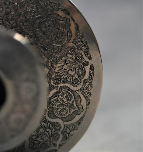 Lot 356 - A 20th century Iranian metalwares vase together with a pair of dwarf candlesticks