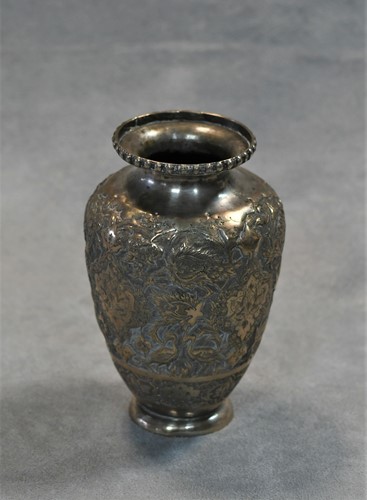 Lot 356 - A 20th century Iranian metalwares vase together with a pair of dwarf candlesticks