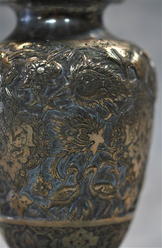 Lot 356 - A 20th century Iranian metalwares vase together with a pair of dwarf candlesticks