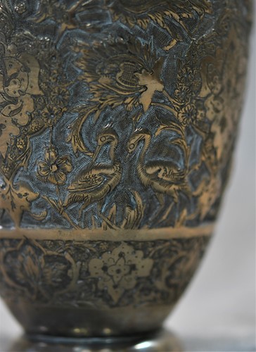 Lot 356 - A 20th century Iranian metalwares vase together with a pair of dwarf candlesticks