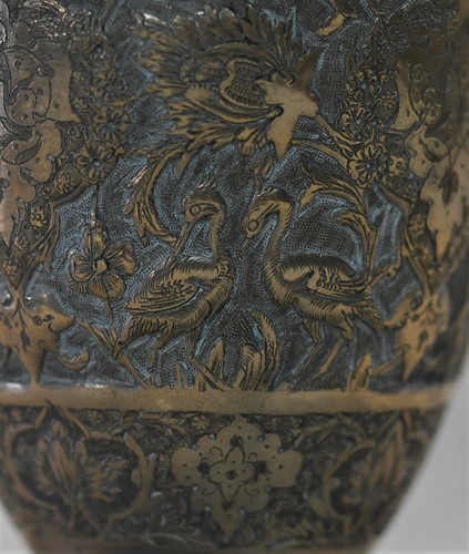 Lot 356 - A 20th century Iranian metalwares vase together with a pair of dwarf candlesticks