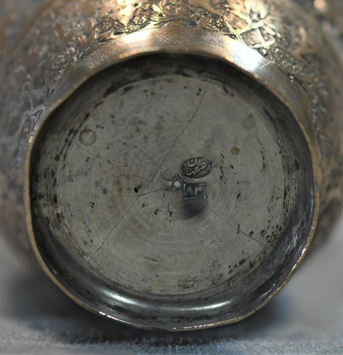 Lot 356 - A 20th century Iranian metalwares vase together with a pair of dwarf candlesticks