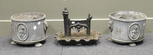 Lot 543 - A pair of lead planters and a cast iron boot...
