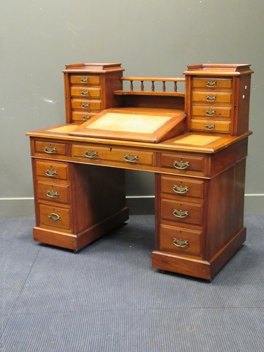 Lot 480 - A late Victorian walnut pedestal desk with...