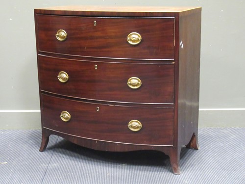 Lot 447 - A Regency mahogany bow front chest of drawers,...