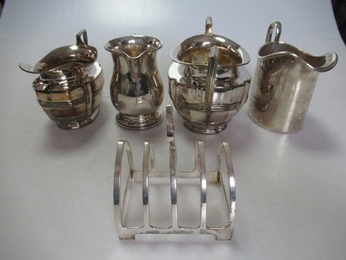 Lot 208 - Three silver jugs, a silver sugar bowl and a...