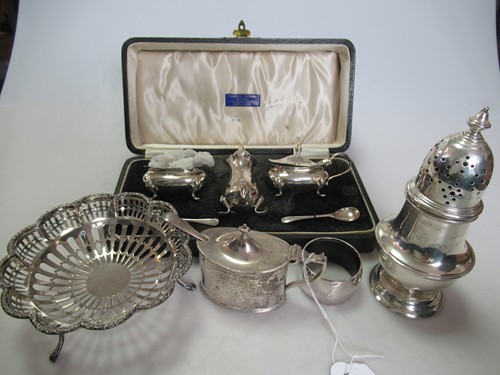 Lot 210 - A silver napkin ring, sugar caster, mustard,...