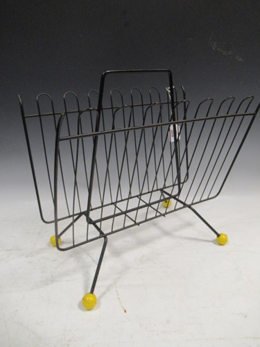 Lot 488 - A 1970's Atomic style wirework magazine rack...