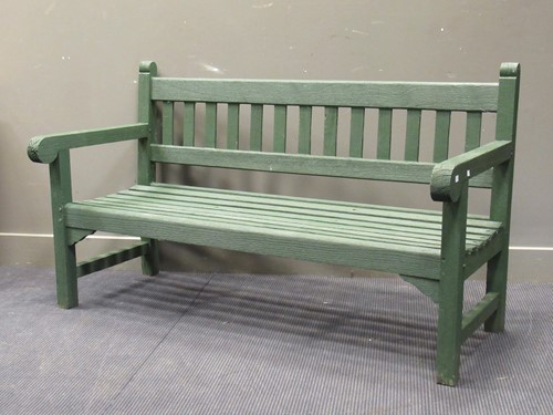 Lot 537 - A three seater green painted garden bench...