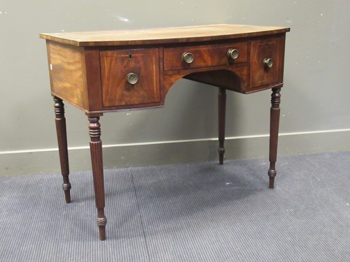 Lot 437 - An early 19th century mahogany bow front side...
