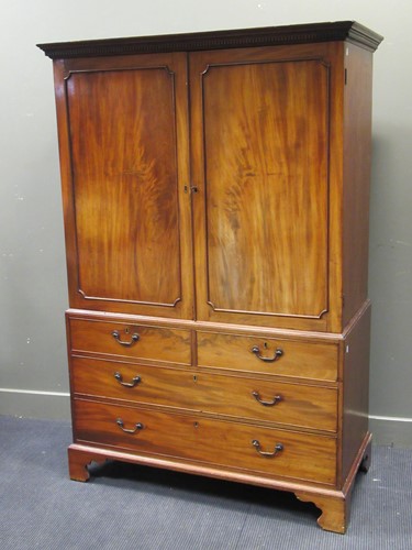 Lot 429 - A 19th century mahogany linen press with...