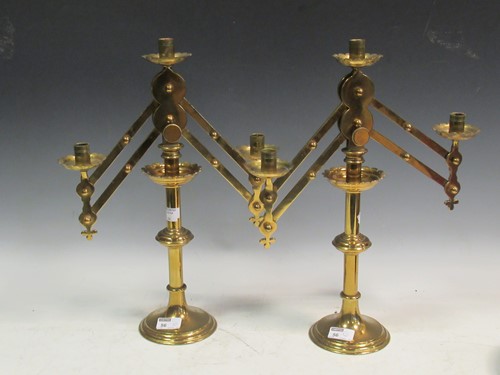 Lot 56 - A pair of adjustable three light brass candelabra