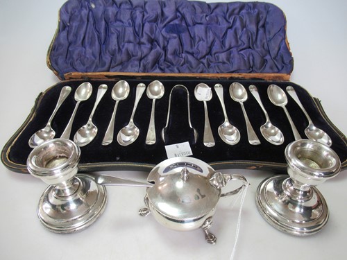 Lot 207 - A pair of silver dwarf candlesticks, together...