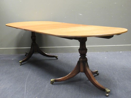 Lot 493 - A reproduction mahogany extending dining table,...