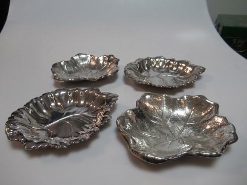 Lot 334 - Two pairs of silver leaf shaped pin trays,...