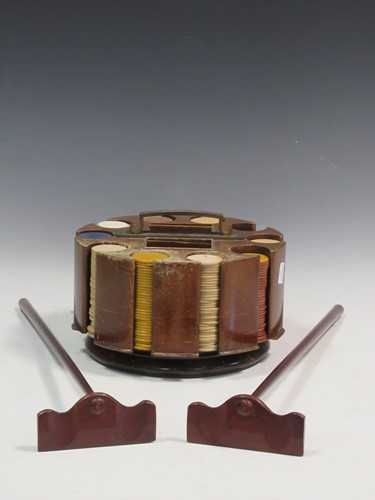 Lot 87 - A set of roulette gaming counters in a wooden...