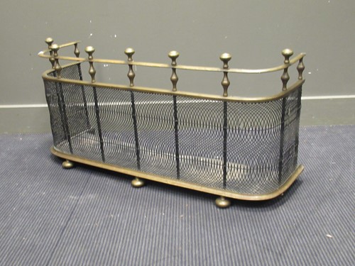 Lot 450 - A 19th century brass fender with a mesh front,...