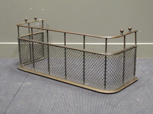 Lot 449 - A 19th century brass fender with a mesh front,...