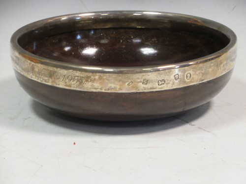 Lot 231 - A silver mounted mazer, the rim inscibed...