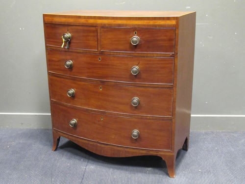 Lot 509 - A 19th century mahogany bow front chest of two...
