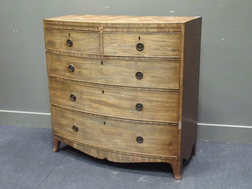 Lot 410 - An early 19th century mahogany bow front chest...
