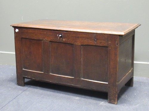 Lot 413 - An 18th century oak coffer, the two plank top...