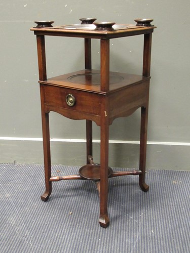Lot 533 - A George III mahogany washstand, the top inset...