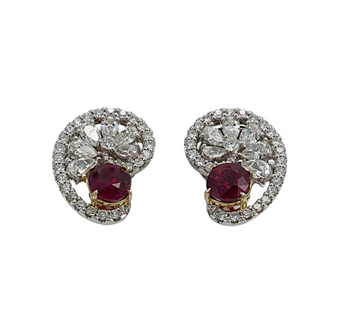 Lot 192 - A pair of ruby and diamond swirl ear studs
