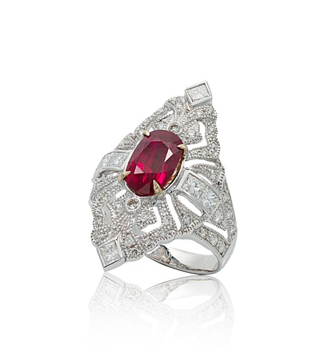 Lot 188 - A ruby and diamond marquise shaped ring