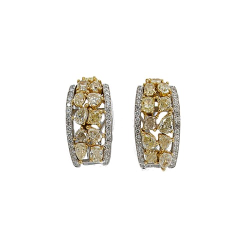 Lot 213 - A pair of yellow and white diamond set hoop style ear studs