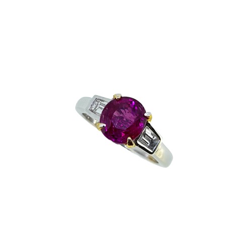 Lot 187 - A ruby ring with diamond set shoulders