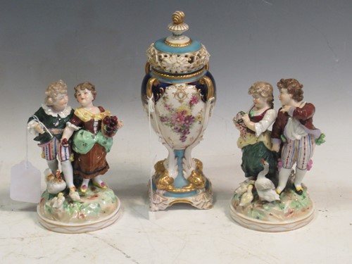 Lot 109 - A pair of continental porcelain figurines in...