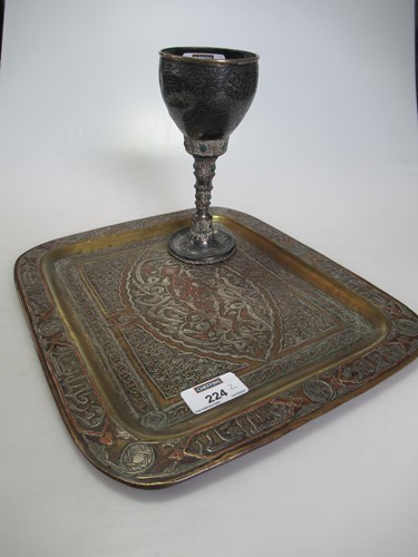 Lot 224 - A Middle Eastern goblet set with oval green...