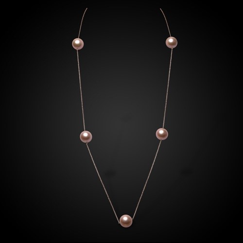 Lot 151 - A rose coloured chain with scattered Edison peach coloured freshwater cultured pearls