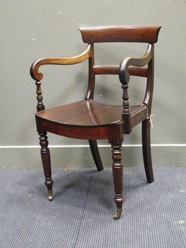 Lot 408 - A William IV mahogany desk/ arm chair, the bar...