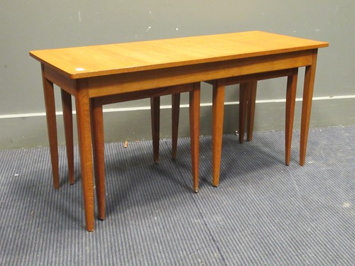 Lot 389 - A 20th century blonde oak nest of tables,...