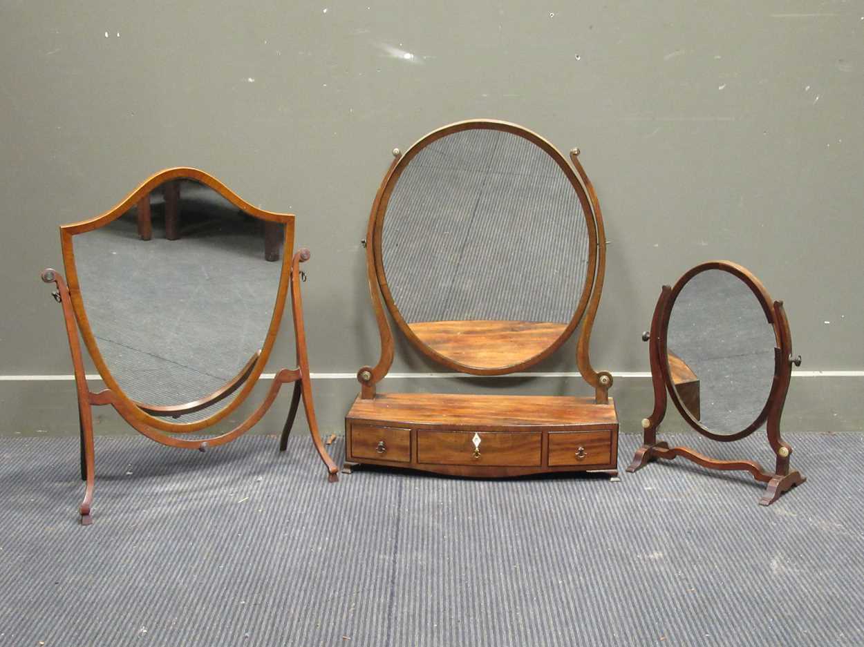 Lot 390 - Regency mahogany oval dressing table mirror,...