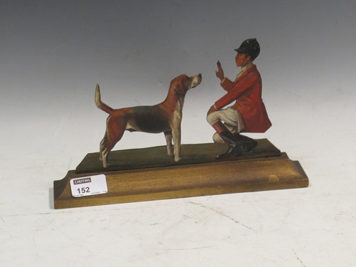 Lot 152 - A painted carved wooden cut out of a hunstmen...