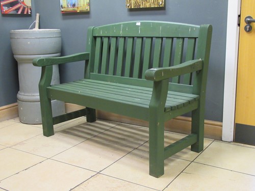 Lot 538 - A green painted garden bench 94 x 123 x 62cm