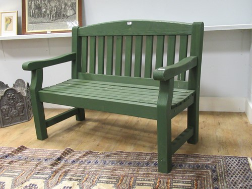 Lot 539 - A green painted garden bench 94 x 123 x 62cm