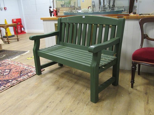 Lot 540 - A green painted garden bench 94 x 123 x 62cm