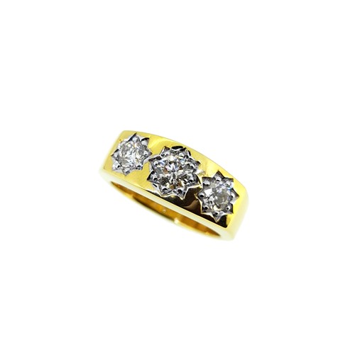 Lot 112 - A three stone dress ring
