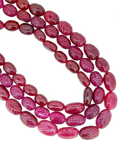 Lot 25 - A three row carved ruby bead necklace