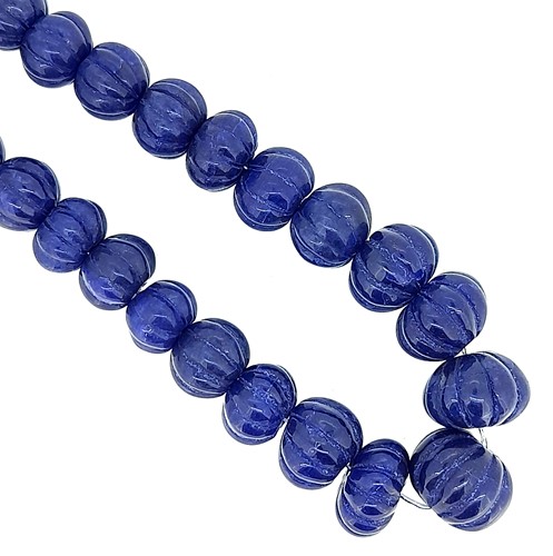 Lot 9 - A single row of carved sapphire beads