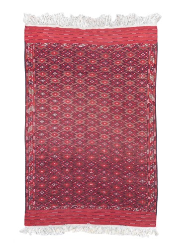 Lot 515 - A red-ground soumak kelly carpet