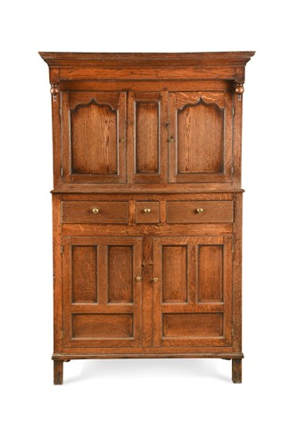 Lot 742 - A George III oak cupboard