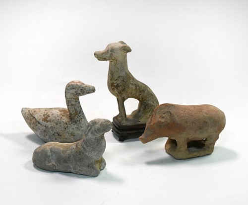 Lot 43 - A group of four Chinese pottery animal figures, Han/Tang Dynasty