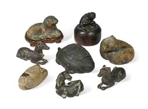 Lot 58 - A group of eight Chinese bronze scroll weights