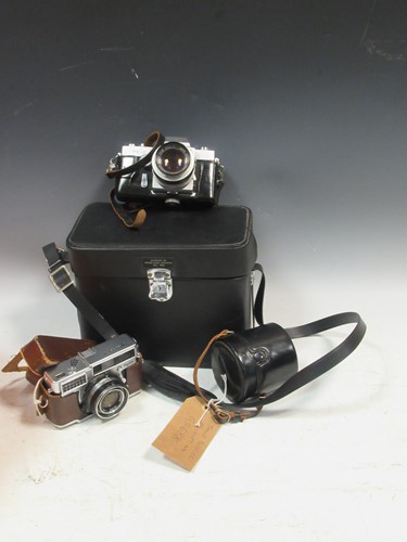 Lot 145 - A Topcon RE-2 camera with three lenses to...